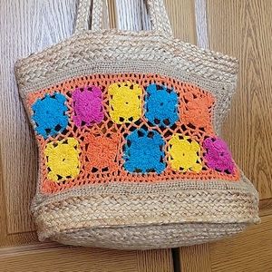 Jute with macrame tote bag. 18 inches wide 14 inches deep with 13 inch straps.